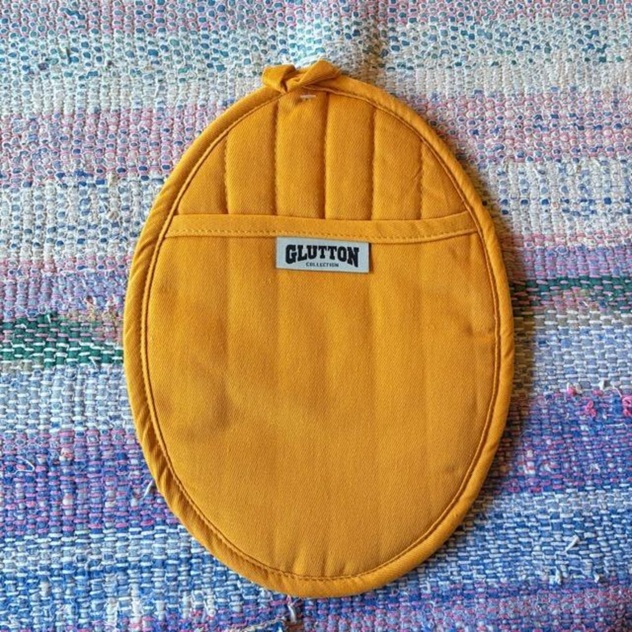 DULTON GLUTTON2 POT HOLDER 3 colors available: Orange, Yellow, and Green. Trivet and pot holder. Ships via mail.