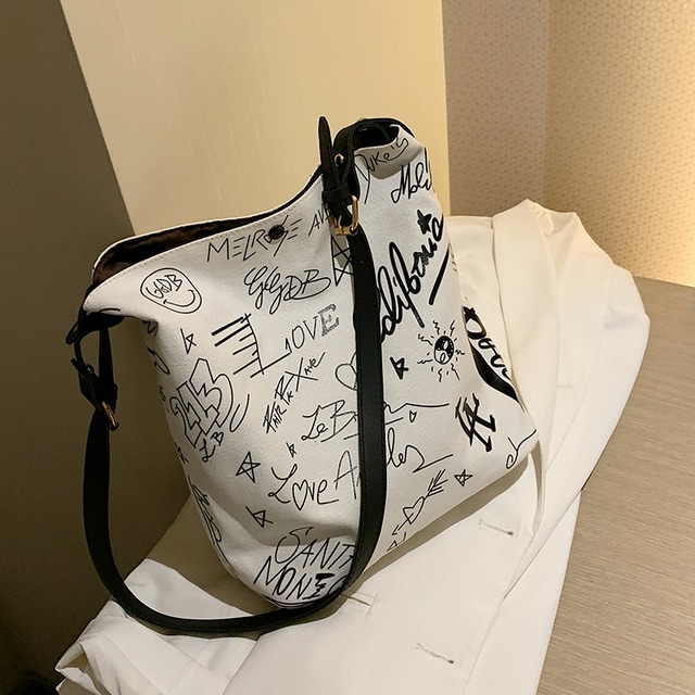 バッグ大容量2020新しいトレンディカジュアルワイルドキャンバスショルダーバッグ夏のファッショングラフィティレディーストートバッグ Tiancai_Wing_Bag6634442