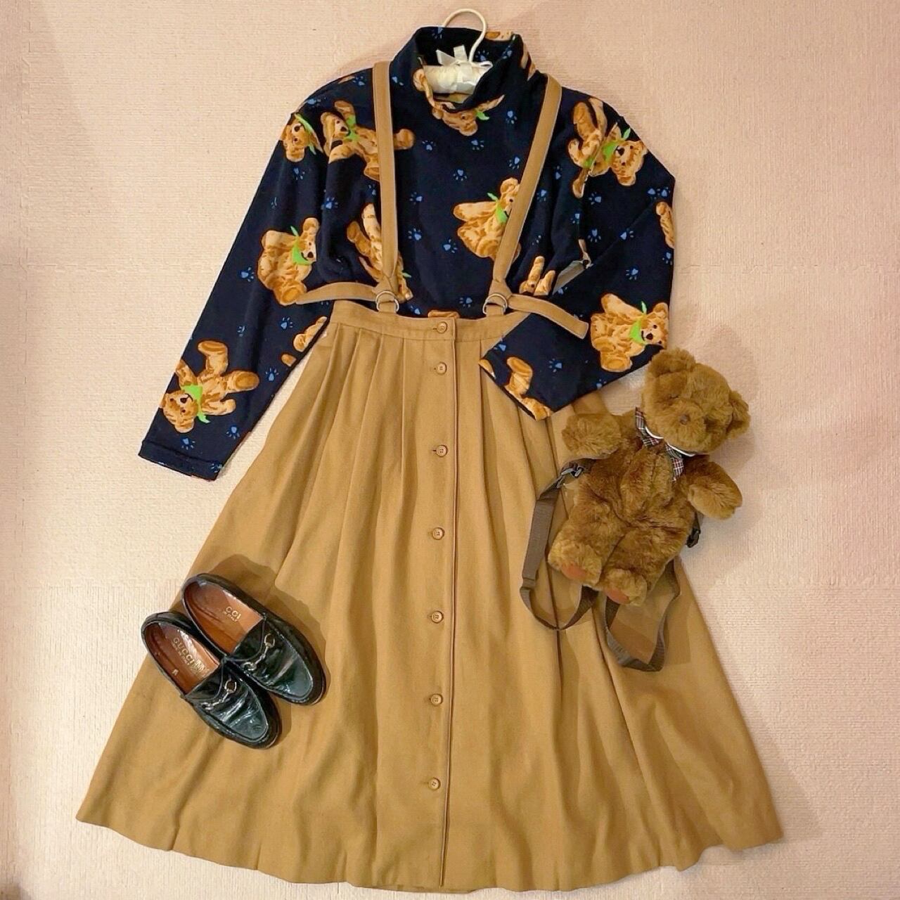 beige front button suspender skirt