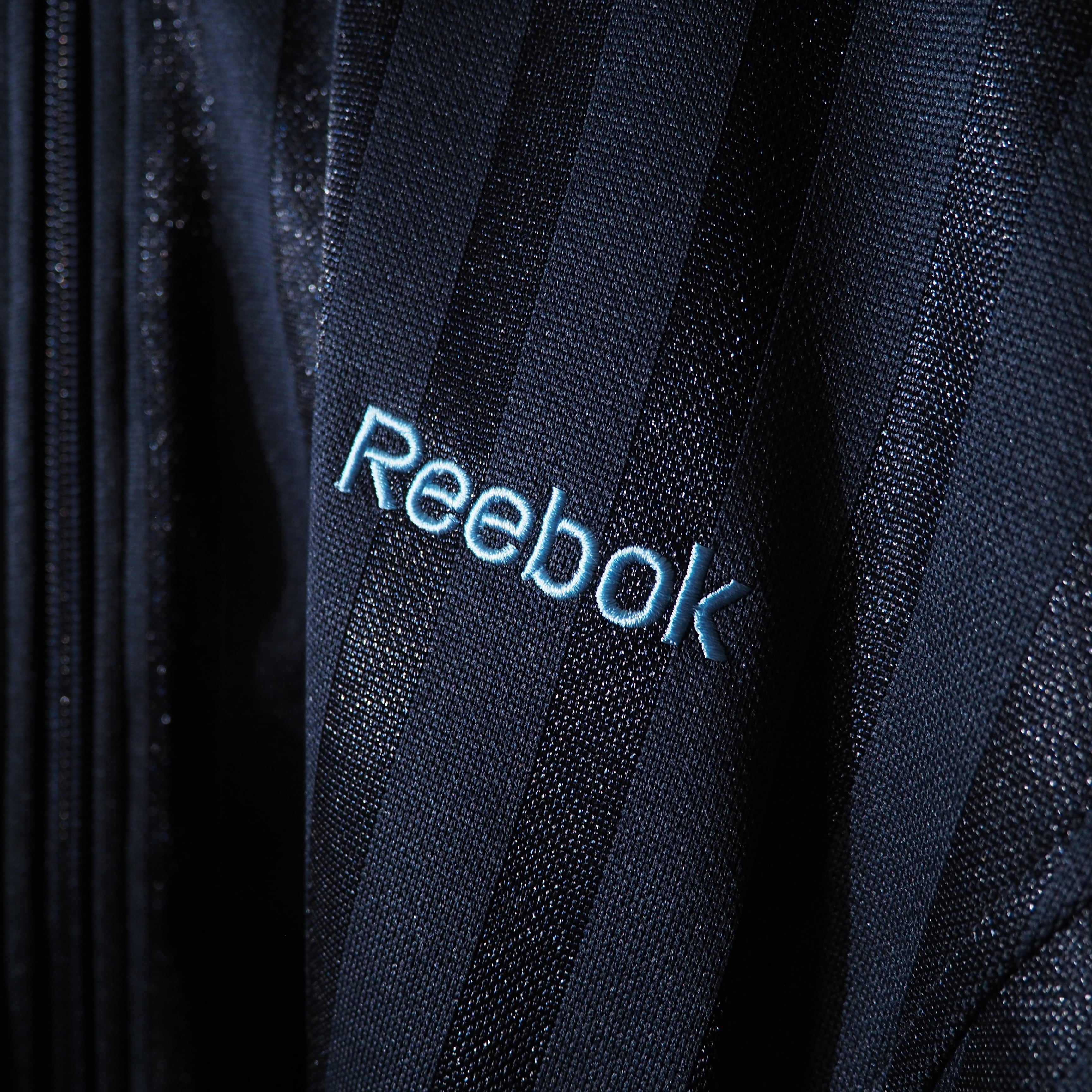 ” Reebok ” Good color line logo printed loose track jacket