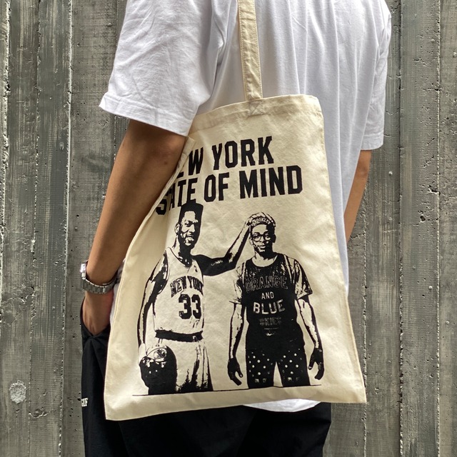 THE CITY NEVER STOPPED BELIEVING TOTE BAG NATURAL