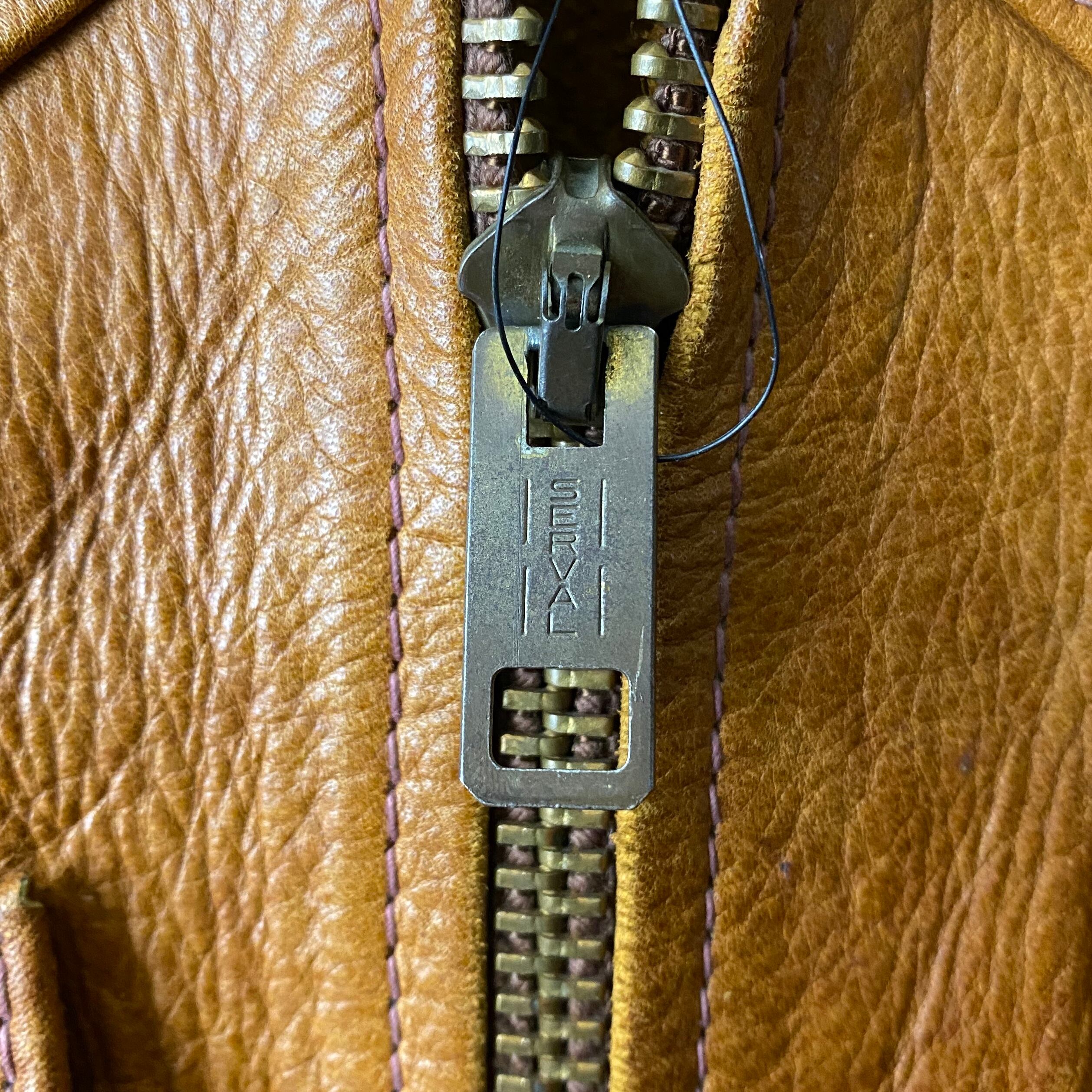 vintage 1970's EAST WEST MUSICAL INSTRUMENTS leather jacket