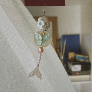 Mermaid remains and butterfly