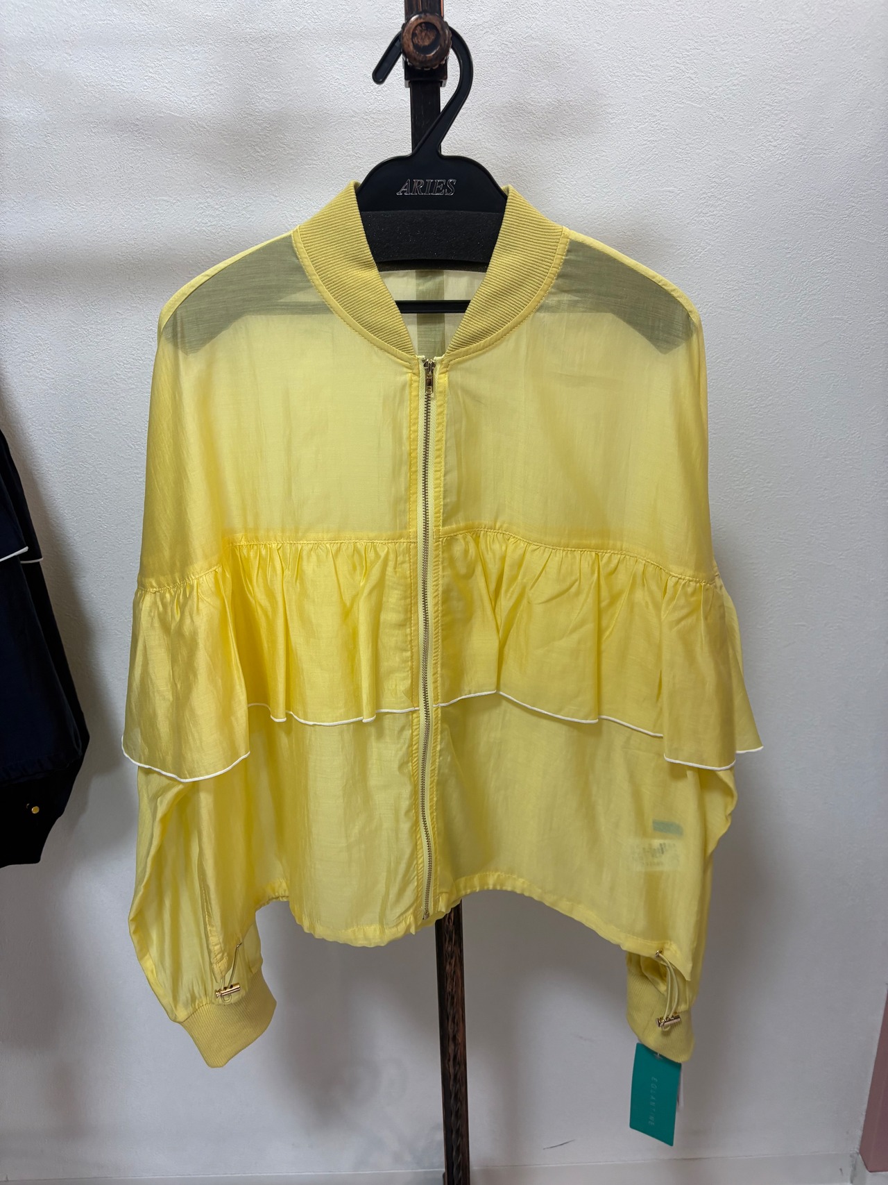 EGLAN TINE シアーフリルトップス　502399