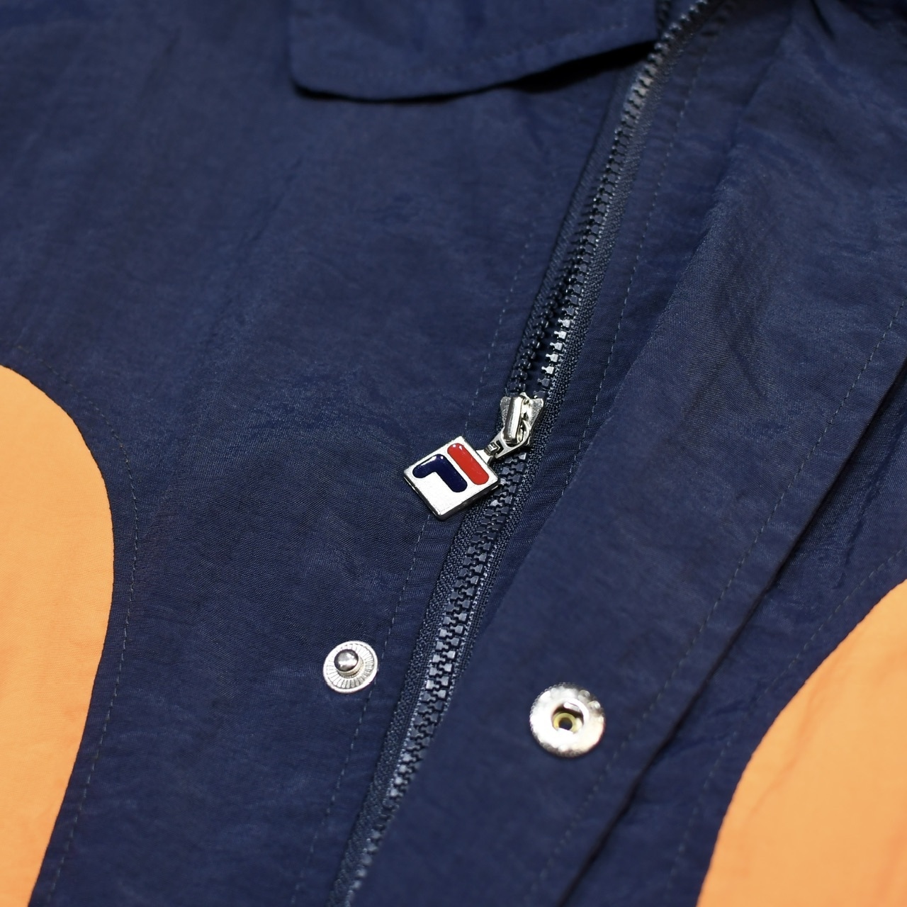 FILA middle length switching design nylon jacket