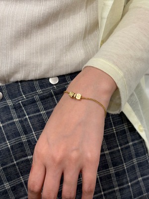 Christian Dior / vintage gold cube logo bracelet.
