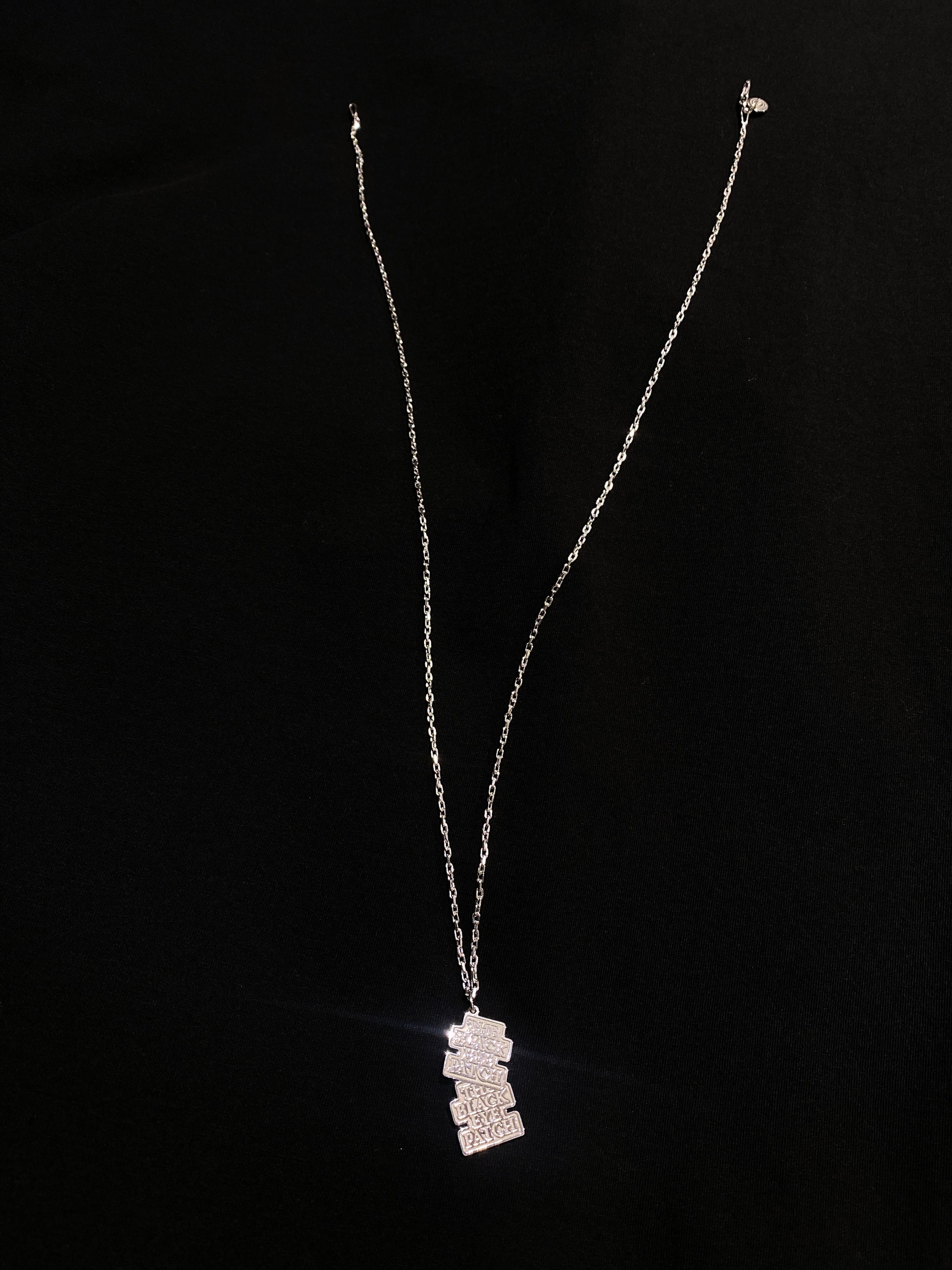 black eye patch careering pendant gold 【公式通販】