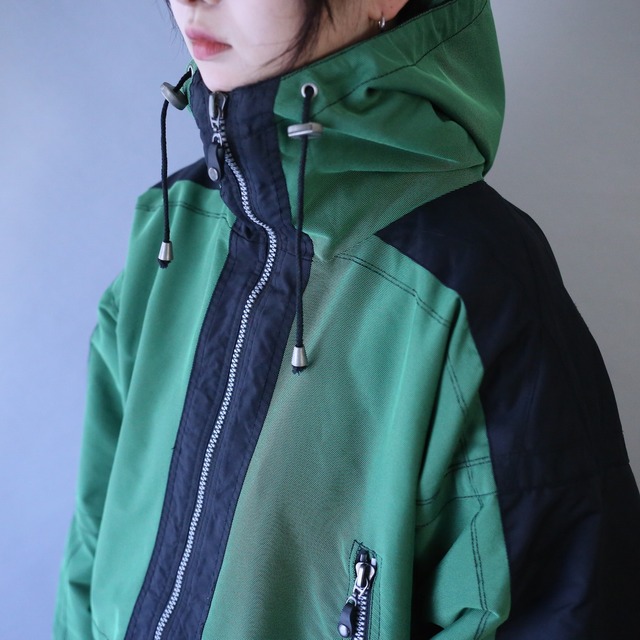 "black×green" bi-color over silhouette gimmick design anorak parka