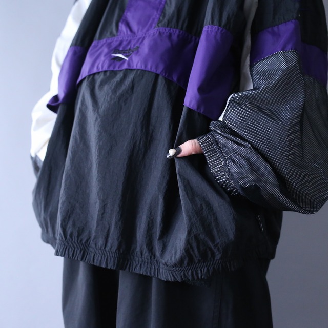 "Reebok" multi color and mesh fabric switching design over silhouette half-zip nylon pullover