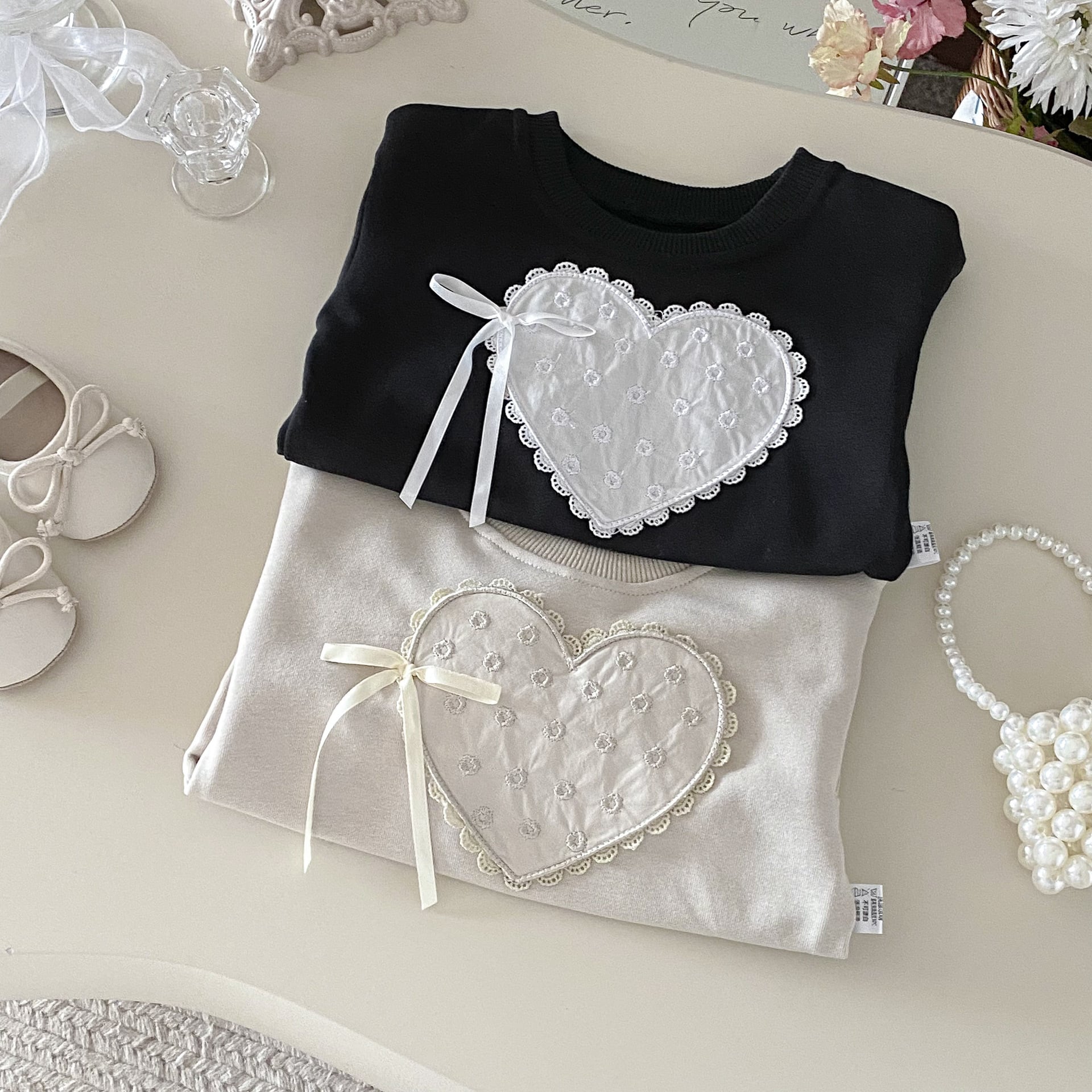 パフスリーブハートリボントレーナー