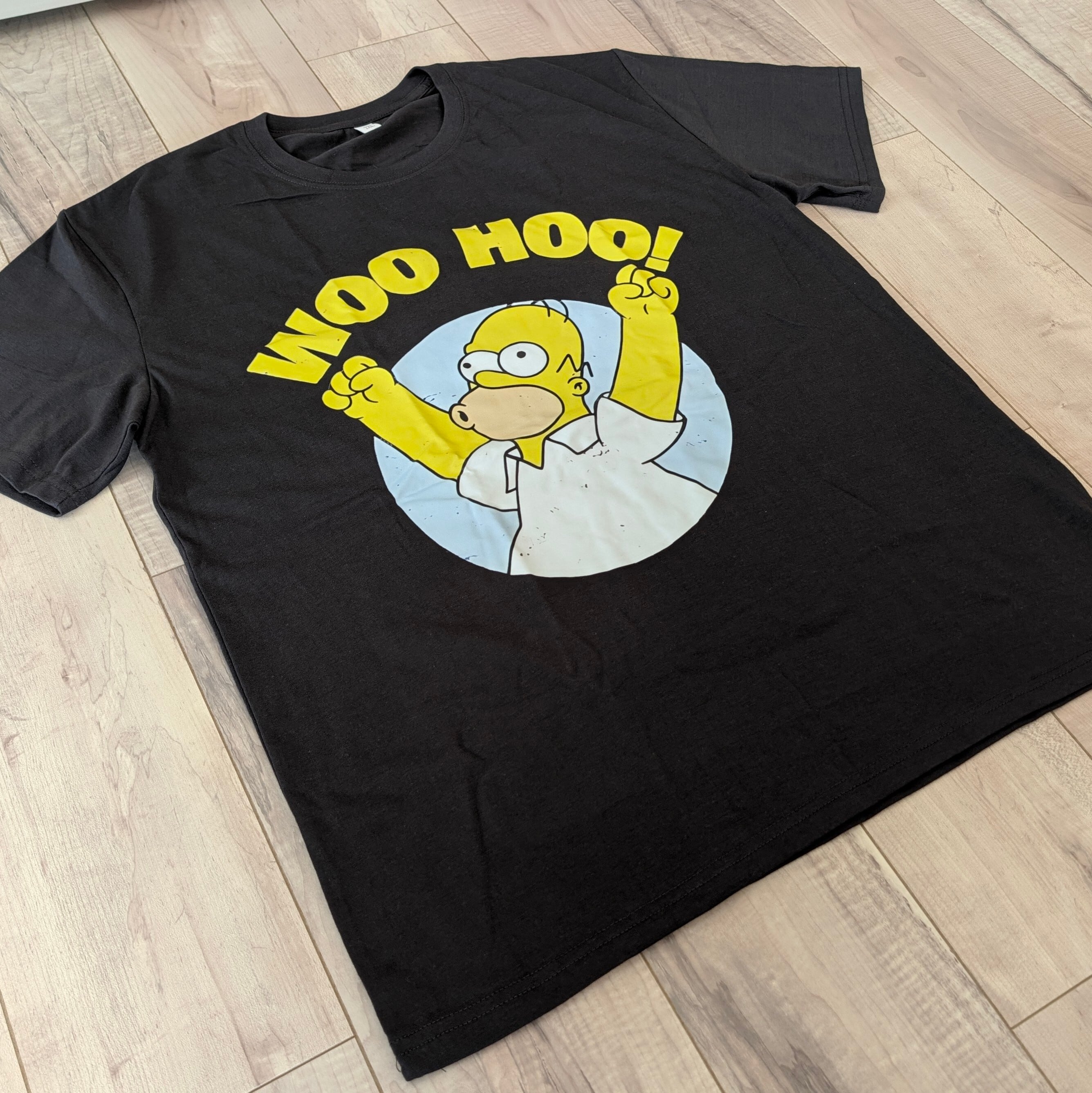 【 The Simpsons（ ザ・シンプソンズ ) 】『 WOO HOO! 』ホーマー呑気なテン上げTシャツ(笑)〚アメリカン雑貨 アメトイ〛