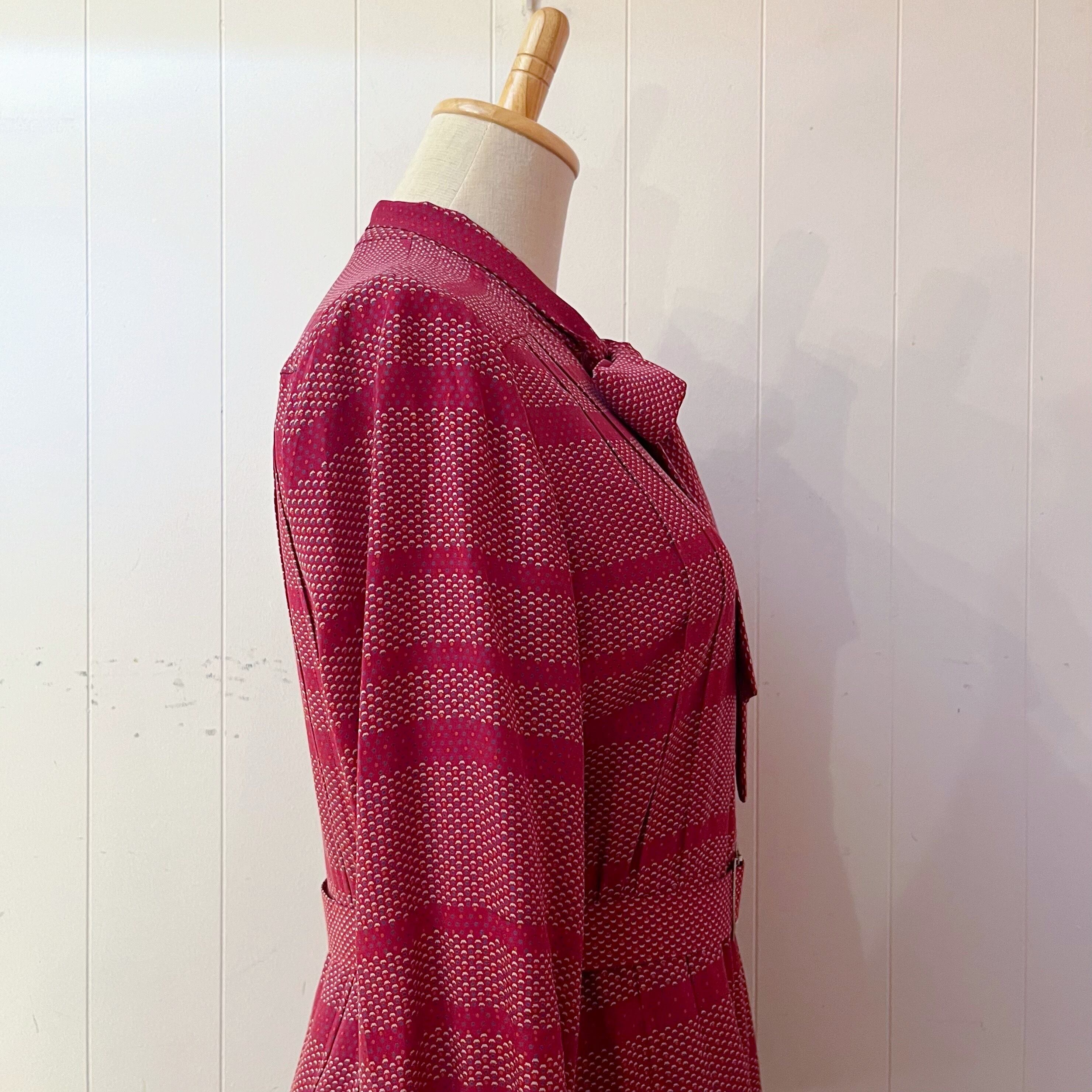 red ribbon tie tuck one-piece