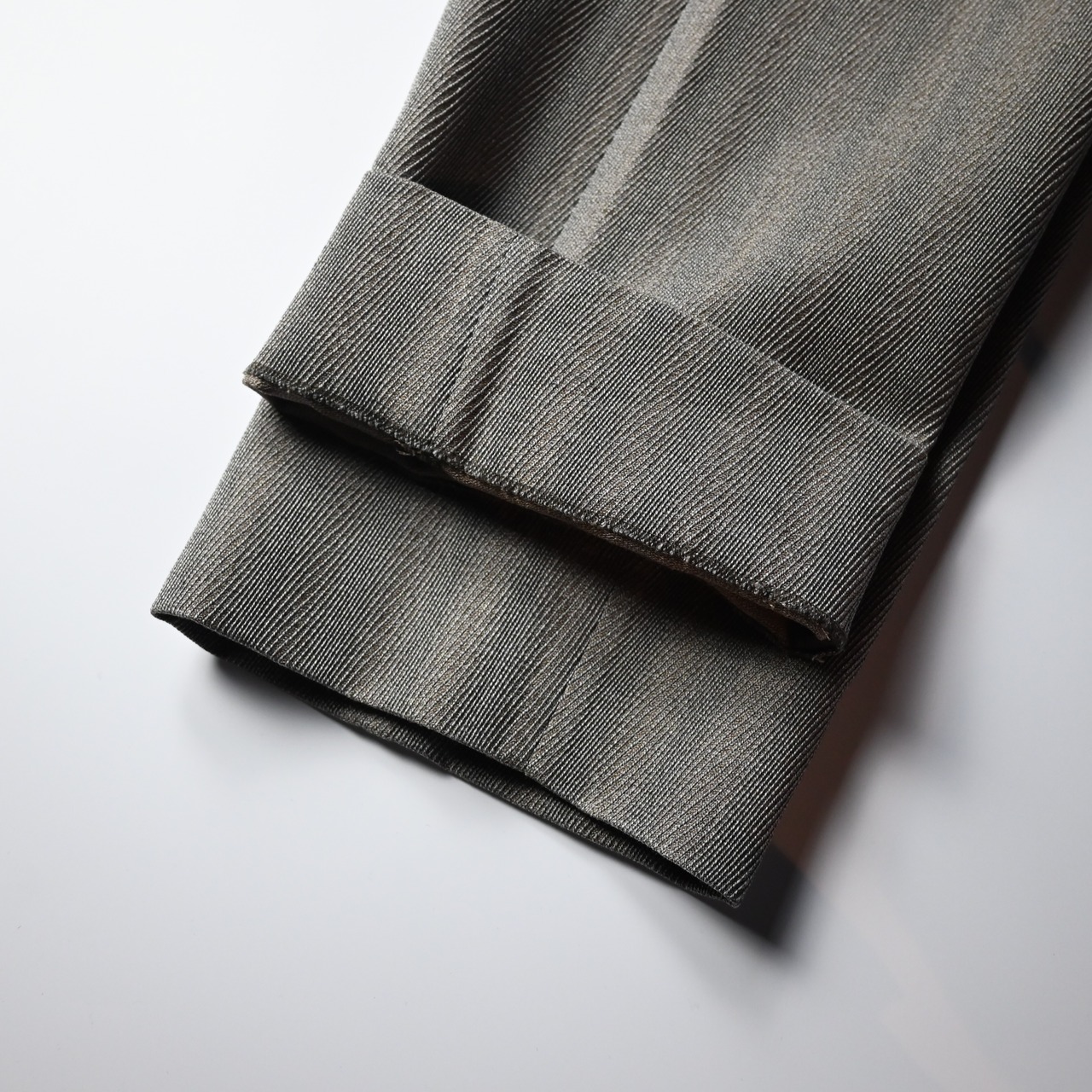 INTERIM / STRUCTURED DIAGONAL MELANGE WOOL DEADSTOCK BELTED MIL BAGGY TROUSER