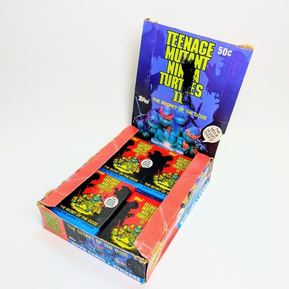 ☆送料無料!☆1991年製 Topps【 Teenage Mutant Ninja Turtles II: The Secret of the Ooze(ティーンエイジ ミュータント ニンジャ タートルズ) 】VINTAGE トレーディングカード単品 (1個=8CARDS+1STICKER)〚アメリカン雑貨 アメトイ〛