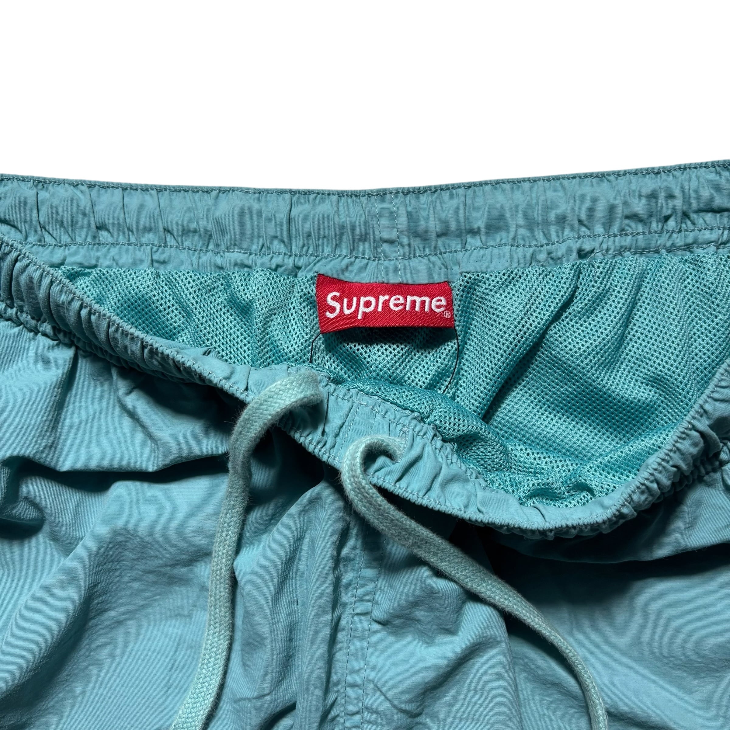 SUPREME logo taping track pants | NOIR ONLINE