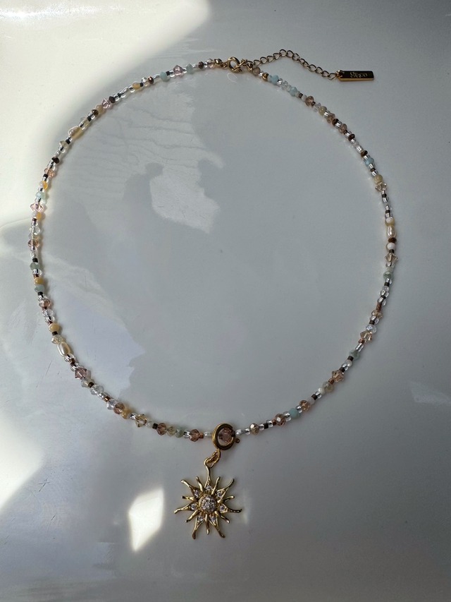 celeste sun necklace