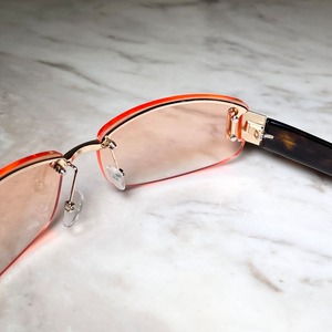 GUCCI half-rim glasses with orange color lens