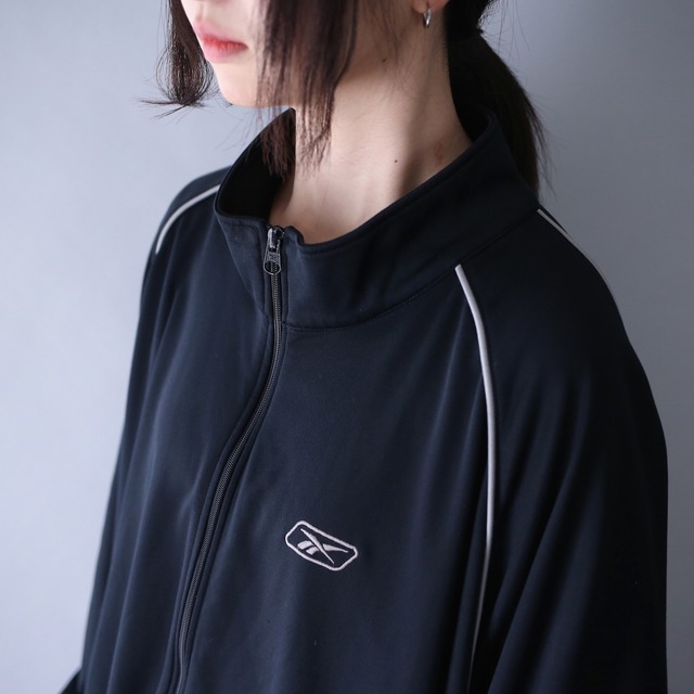 "Reebok" piping line design over silhouette track jacket