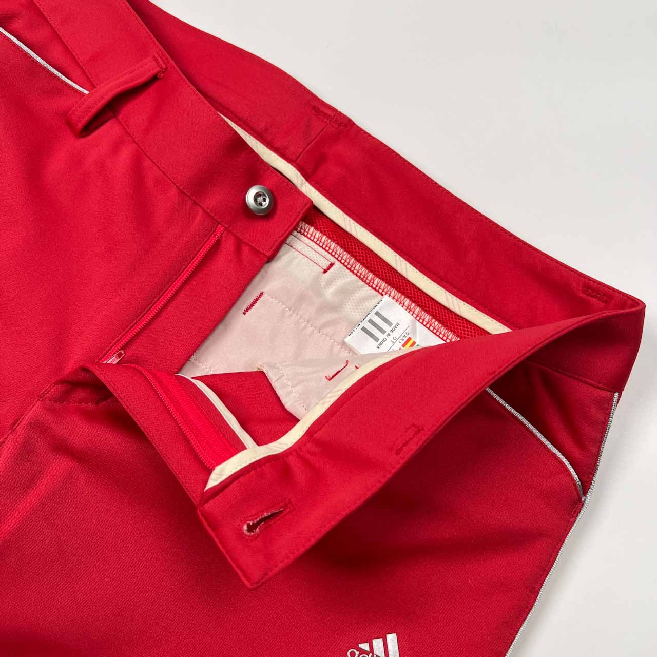 美品 adidas GOLF アディダス ゴルフ 裾フレア スラックスパンツ サイズ OT /レッド系