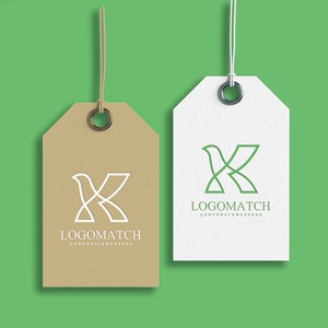 優雅に羽ばたく鳥のKのロゴ