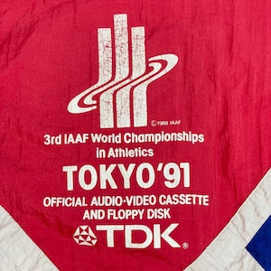 【adidas】80s 世界陸上 1991 東京大会 企業系 企業ロゴ スポンサー TDK ナイロンジャケット ブルゾン プリント 刺繍ロゴ トレフォイル ワンポイント 切替 銀タグ 万国旗タグ コピーライト1988 ヴィンテージ 希少 アディダス us古着