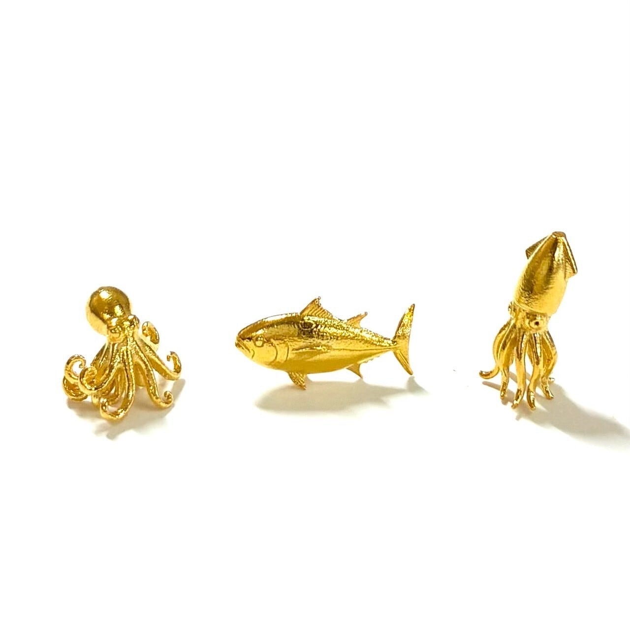 純金のタコ 約1グラム JUNGOLD 指先サイズの芸術品 額縁ケース付き