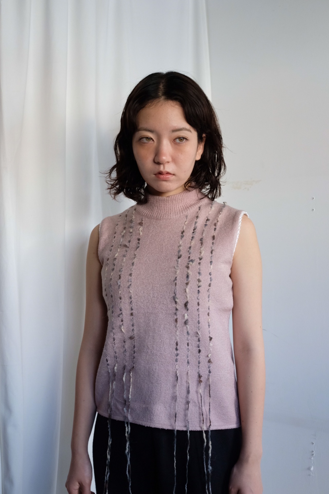 Sleeveless turtleneck knit top