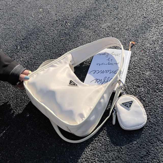 夏のスモールバッグウエスタンスタイルの女性バッグ2020人気の新しい流行のファッションレディメッセンジャーバッグシンプルなワンショルダー脇の下バッグ 手作りハンドバック25656587097