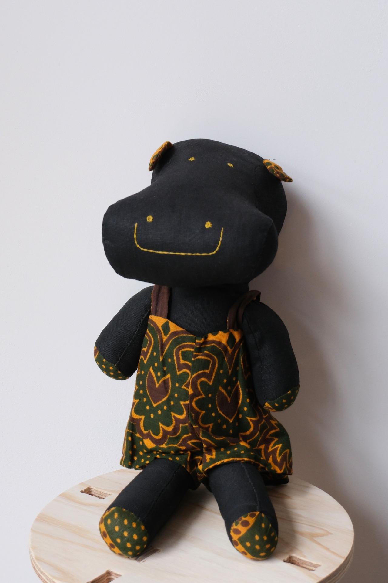 Handmade stuffed smiley hippo