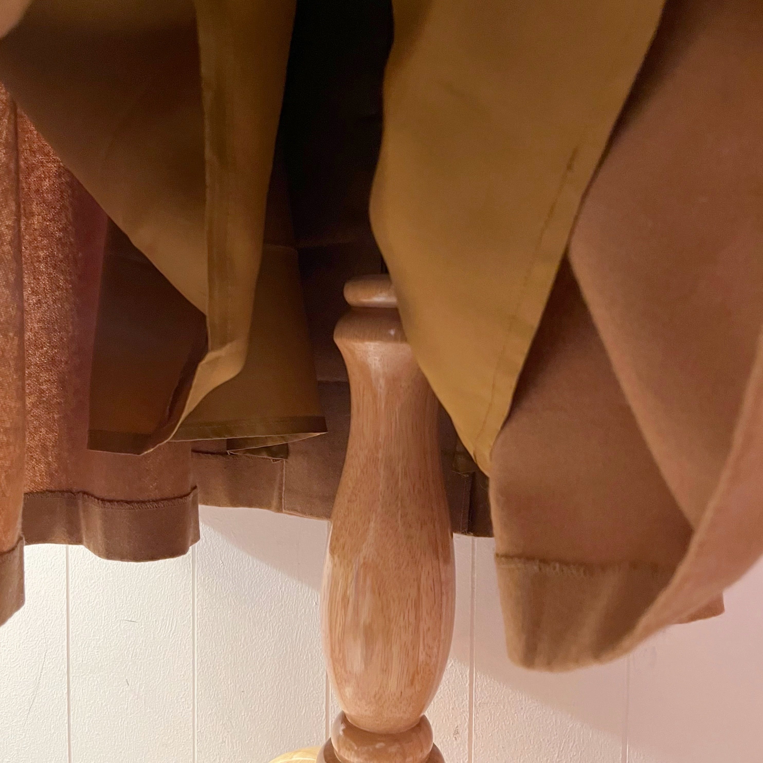 beige front button suspender skirt