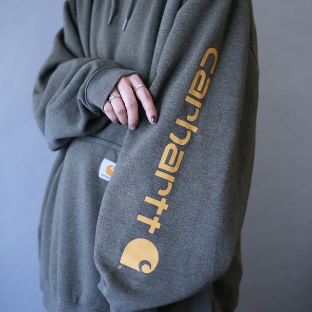 "Carhartt" sleeve logo printed over silhouette khaki sweat parka