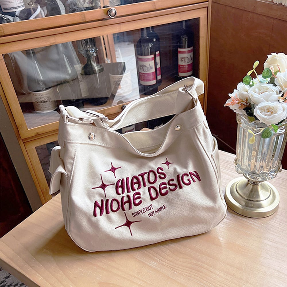 ショルダーバッグ キャンバス 大容量 通学 レディース ロゴ入り 肩掛け