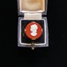Brick red & white cameo round ring