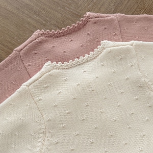 〈80-110size〉pink×whiteフリルニットカーディガン
