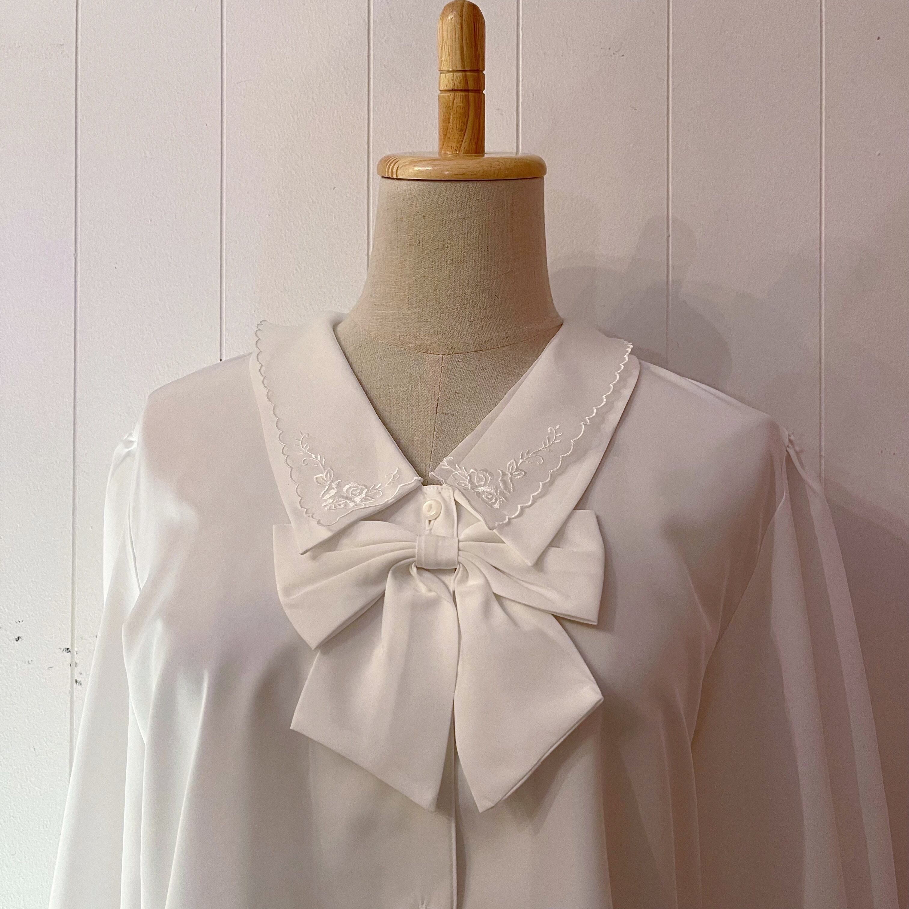 ribbon brooch white blouse