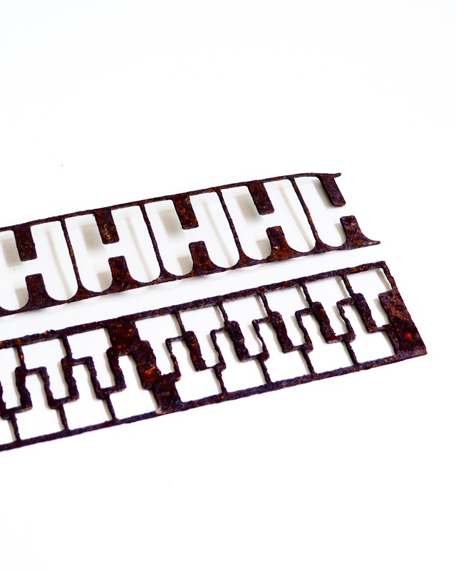Frame with geometric, regular, die-cut patterns