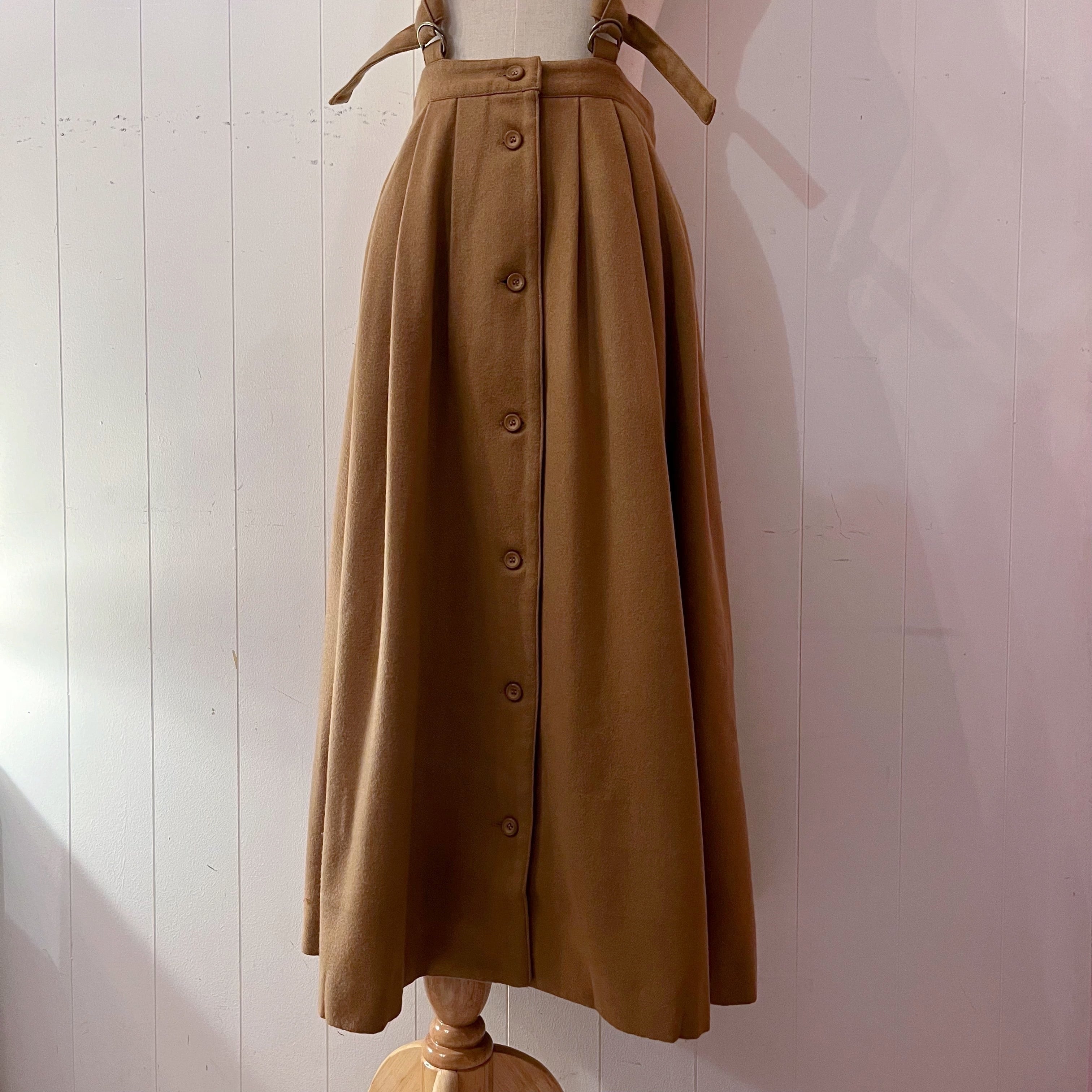 beige front button suspender skirt