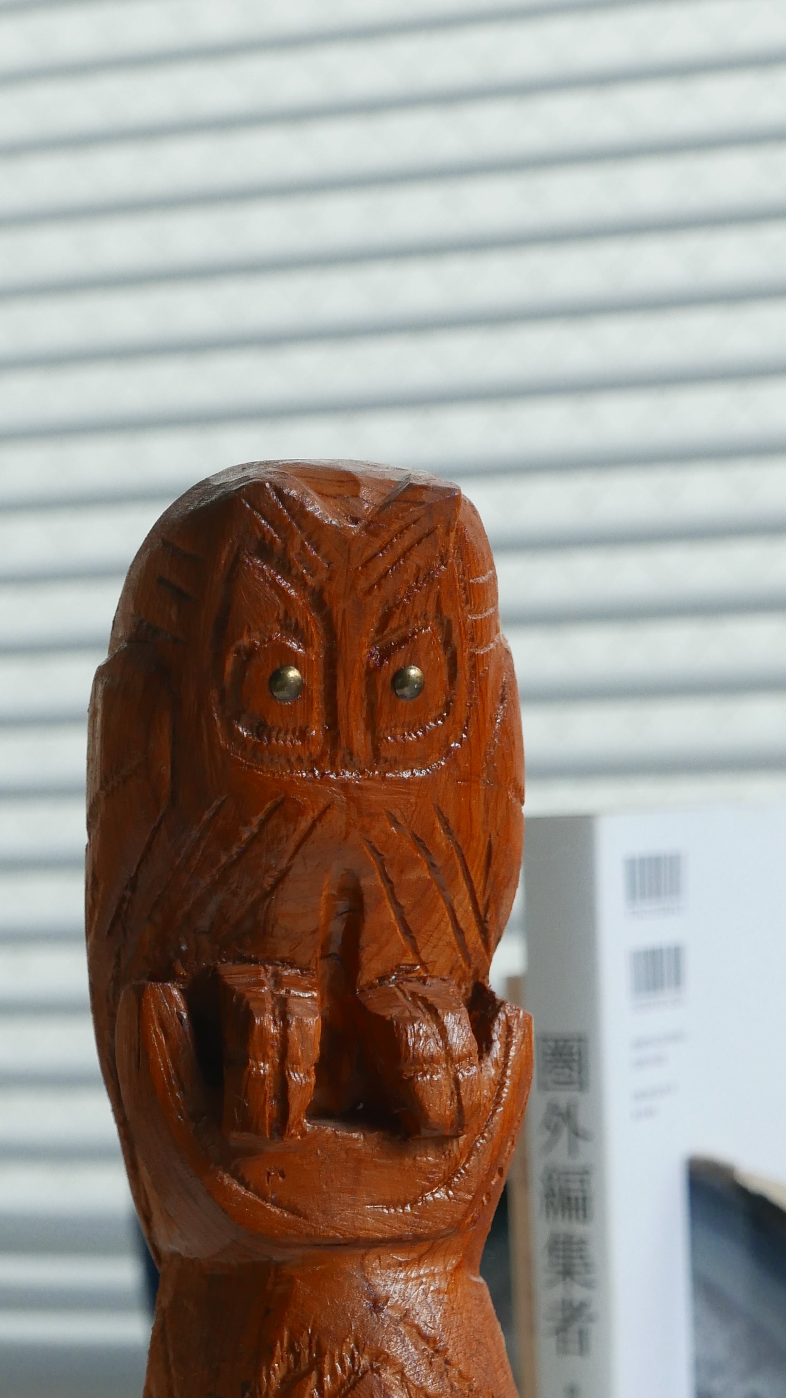 carved owl, aged with repair