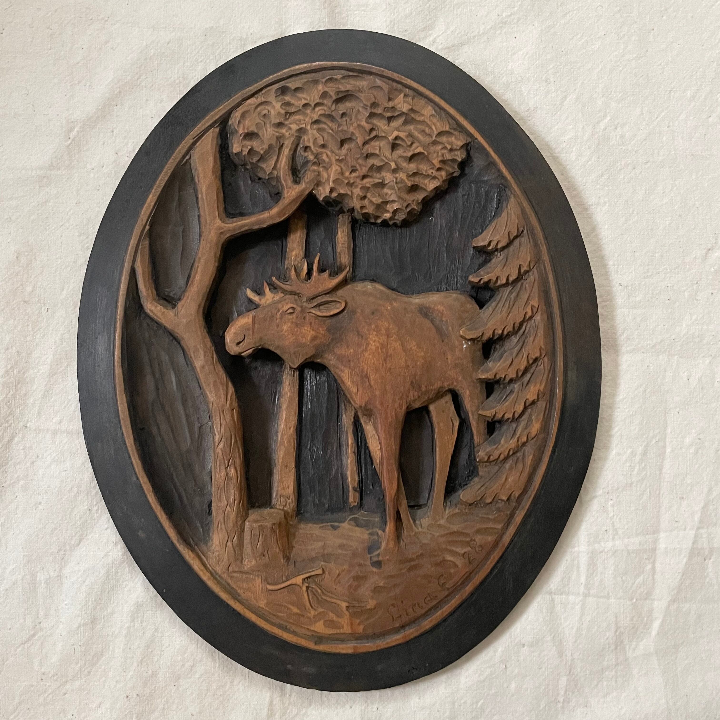 木彫りのヘラジカの壁掛け