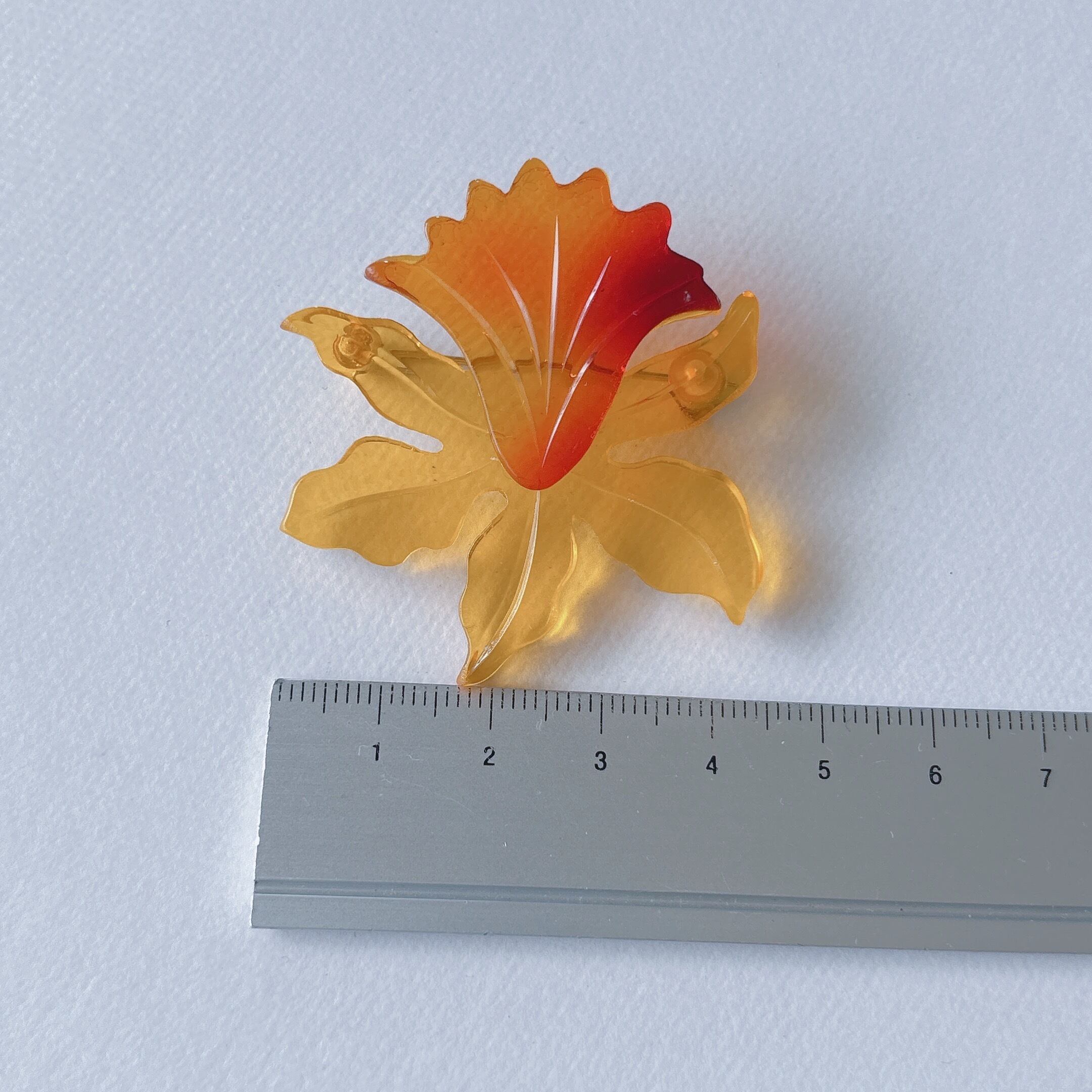 Vintage yellow orange amber acrylic plastic flower cattleya brooch