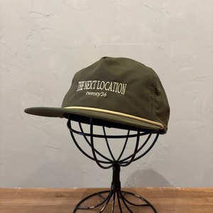 THE NEXT LOCATION CAP