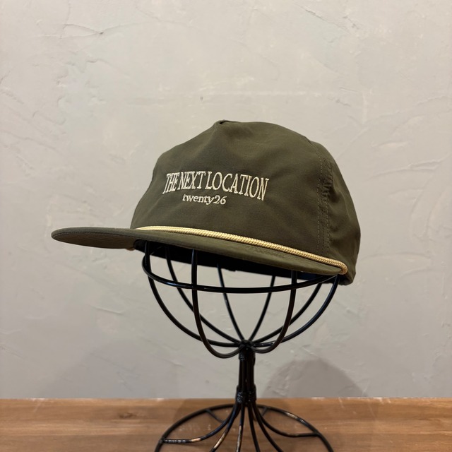 THE NEXT LOCATION CAP