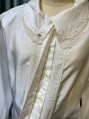 white embroidery pin tuck blouse