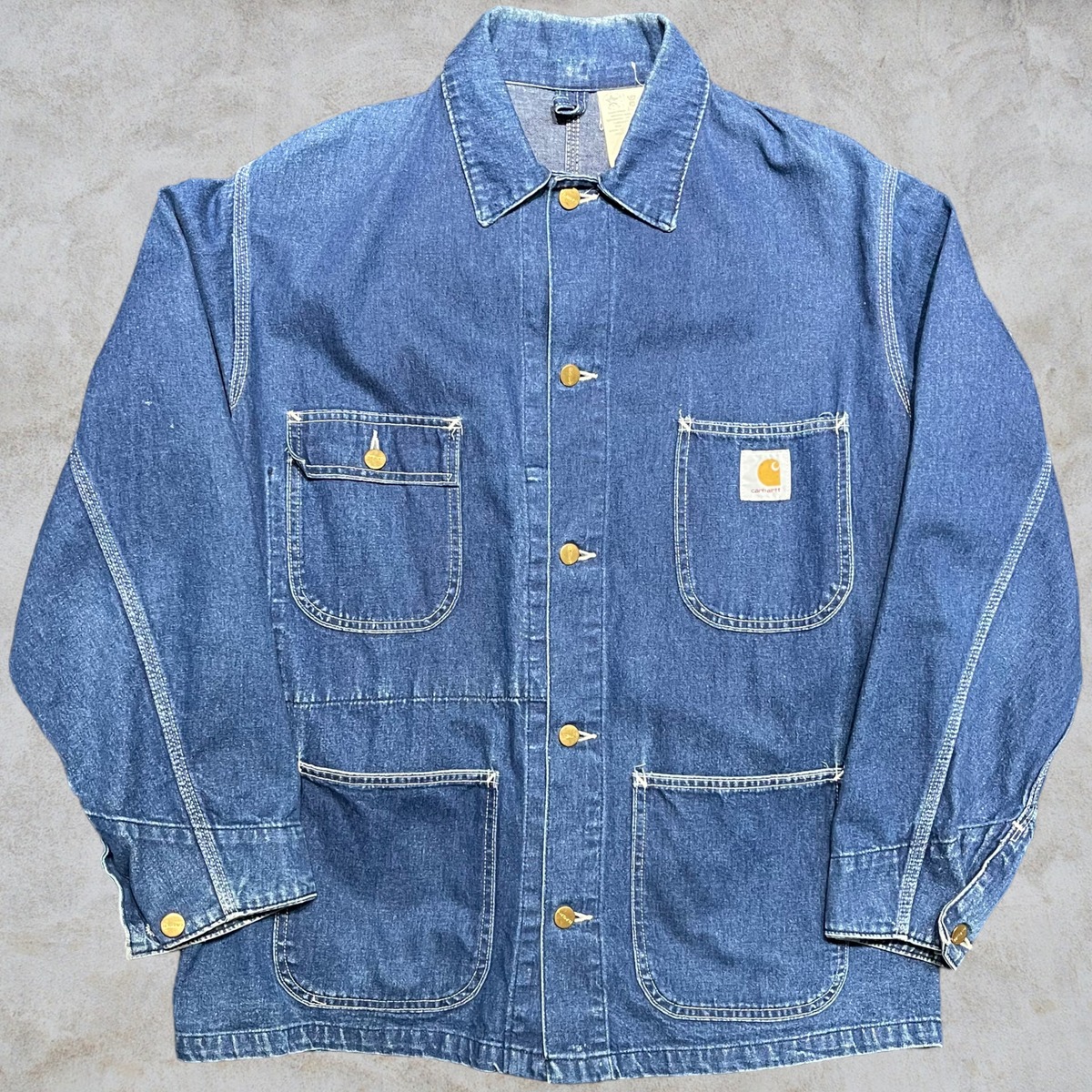 90’s Carhartt Michigan Denim Chore Coat curb