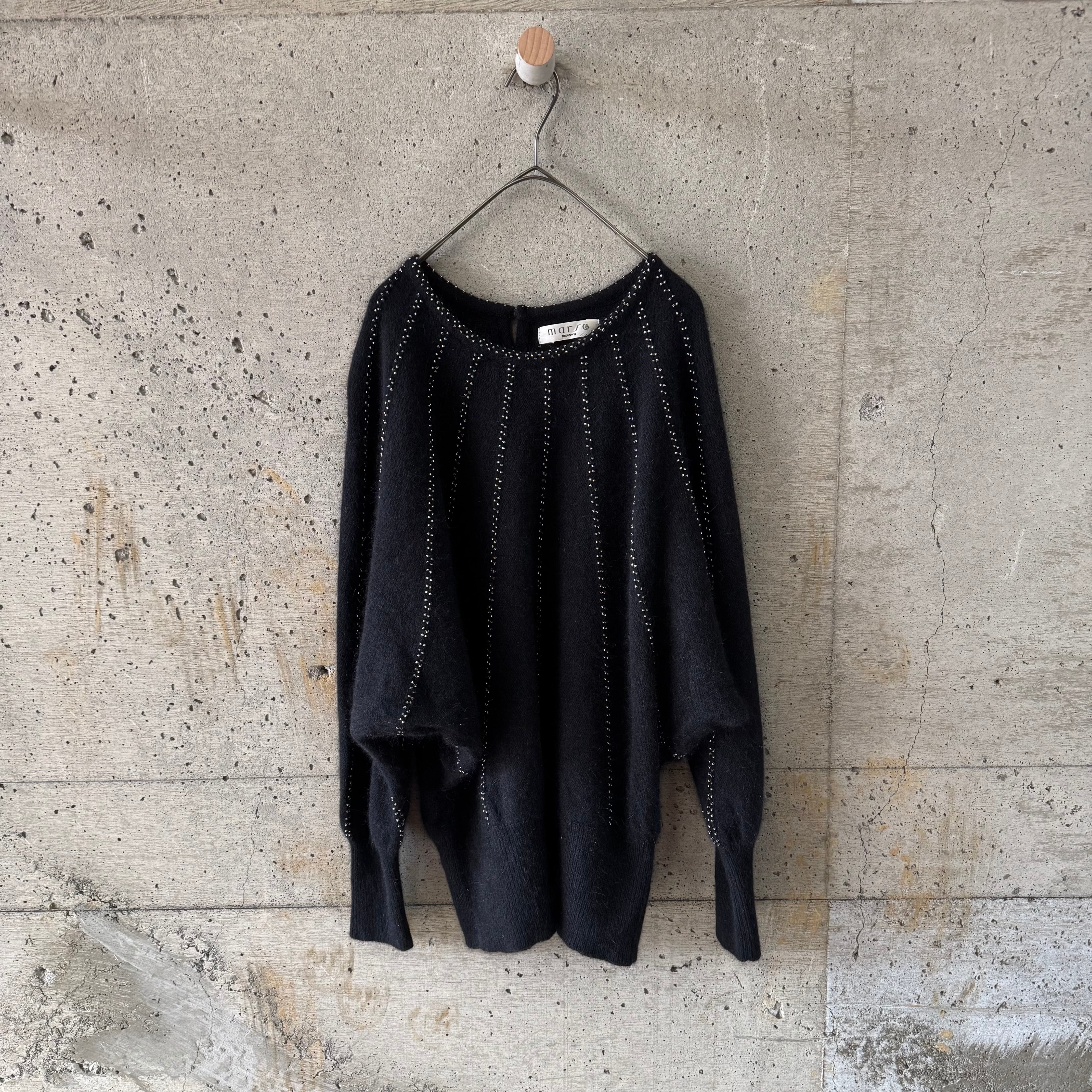 Dolman sleeve knit with radial beads