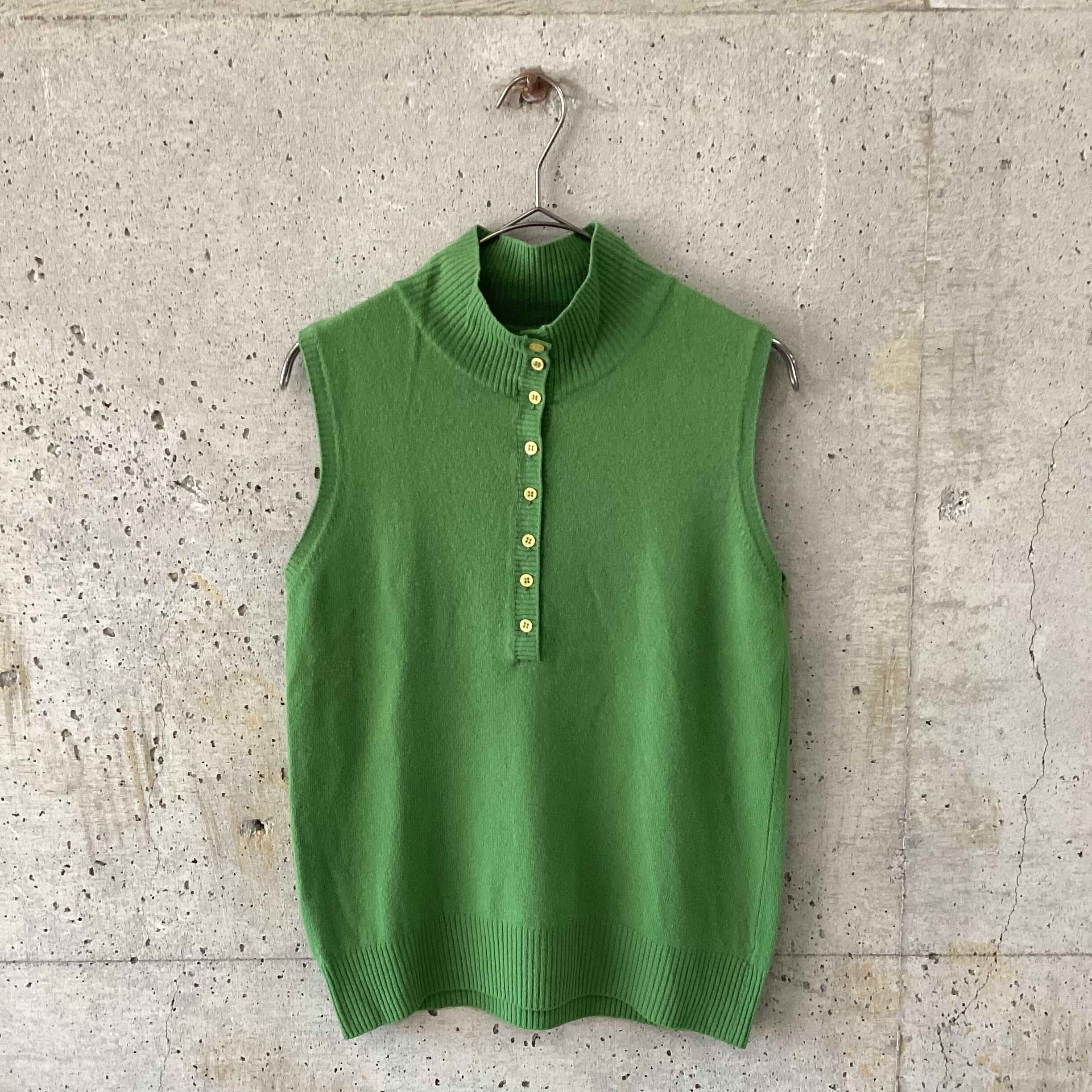 green knit vest with lots of buttons