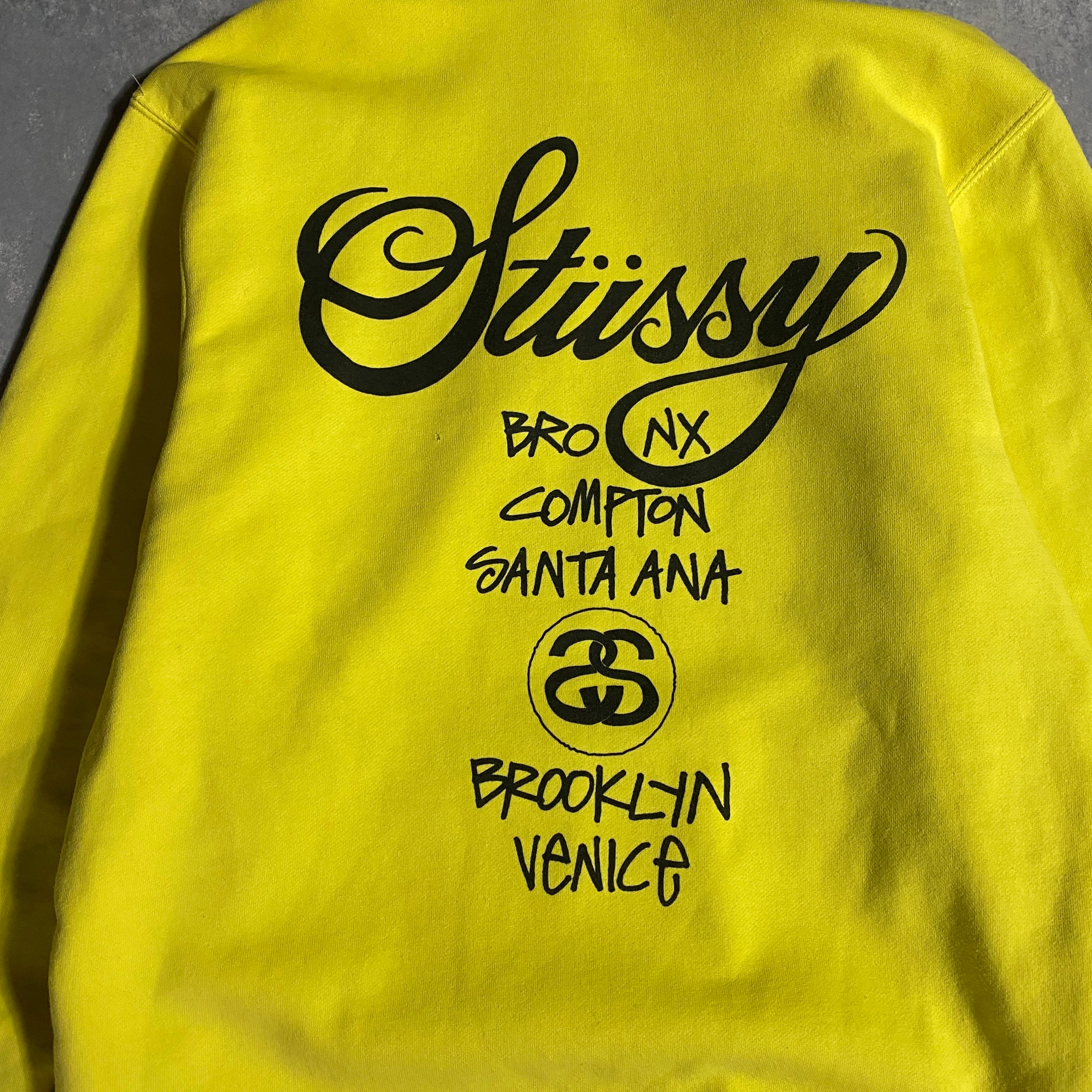 STUSSY ステューシー パーカー ロゴ バックプリント ワールドツアー