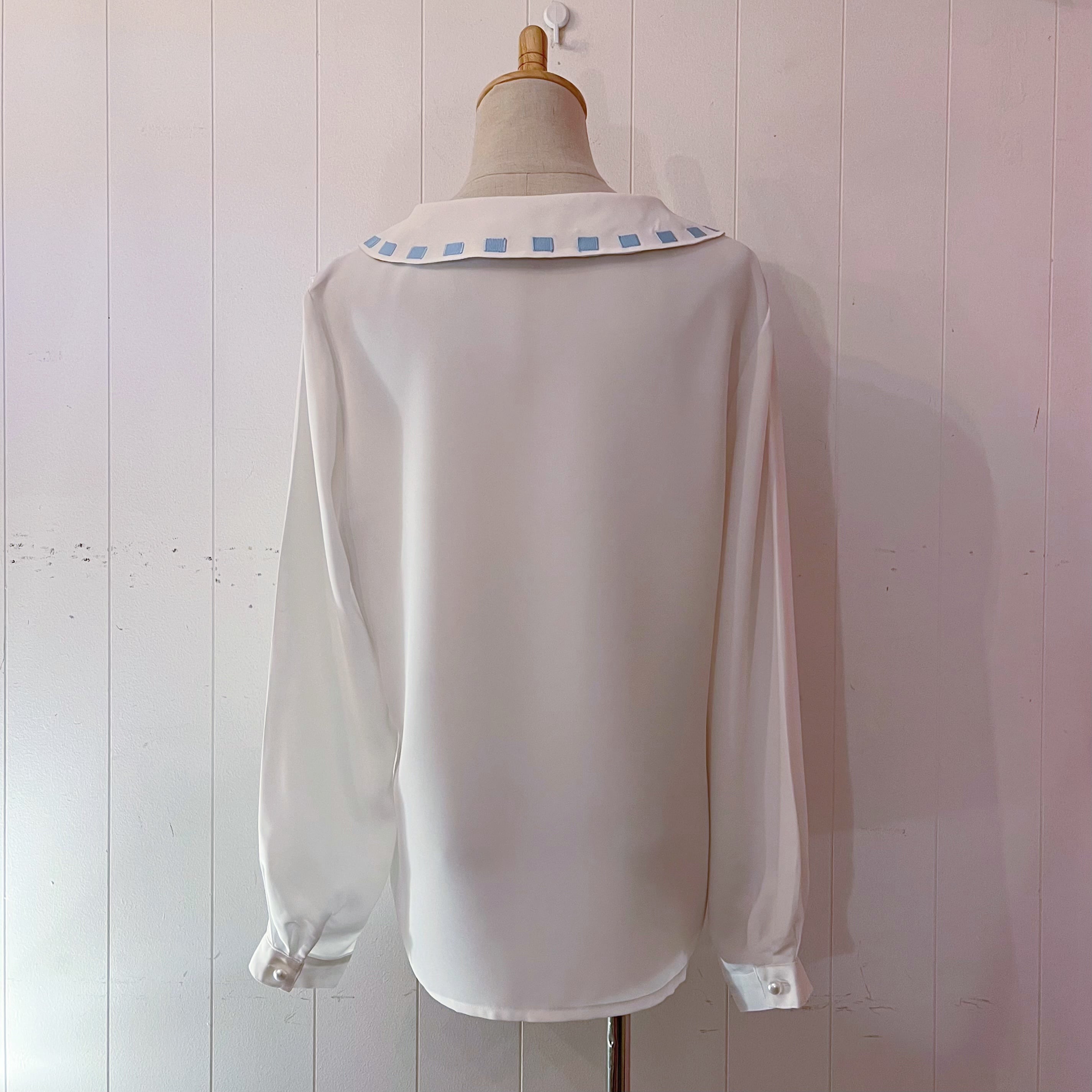 light blue ribbon white blouse