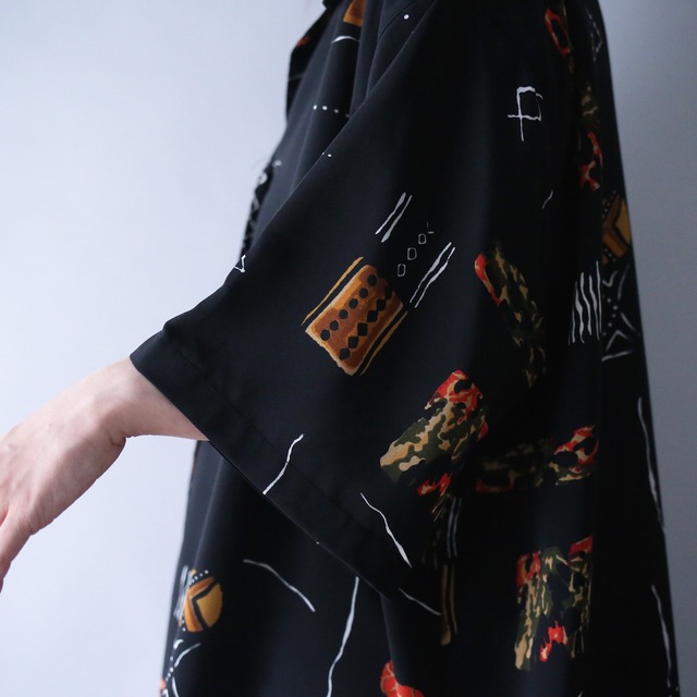 geometry art graphic pattern XXX over silhouette open collar h/s shirt