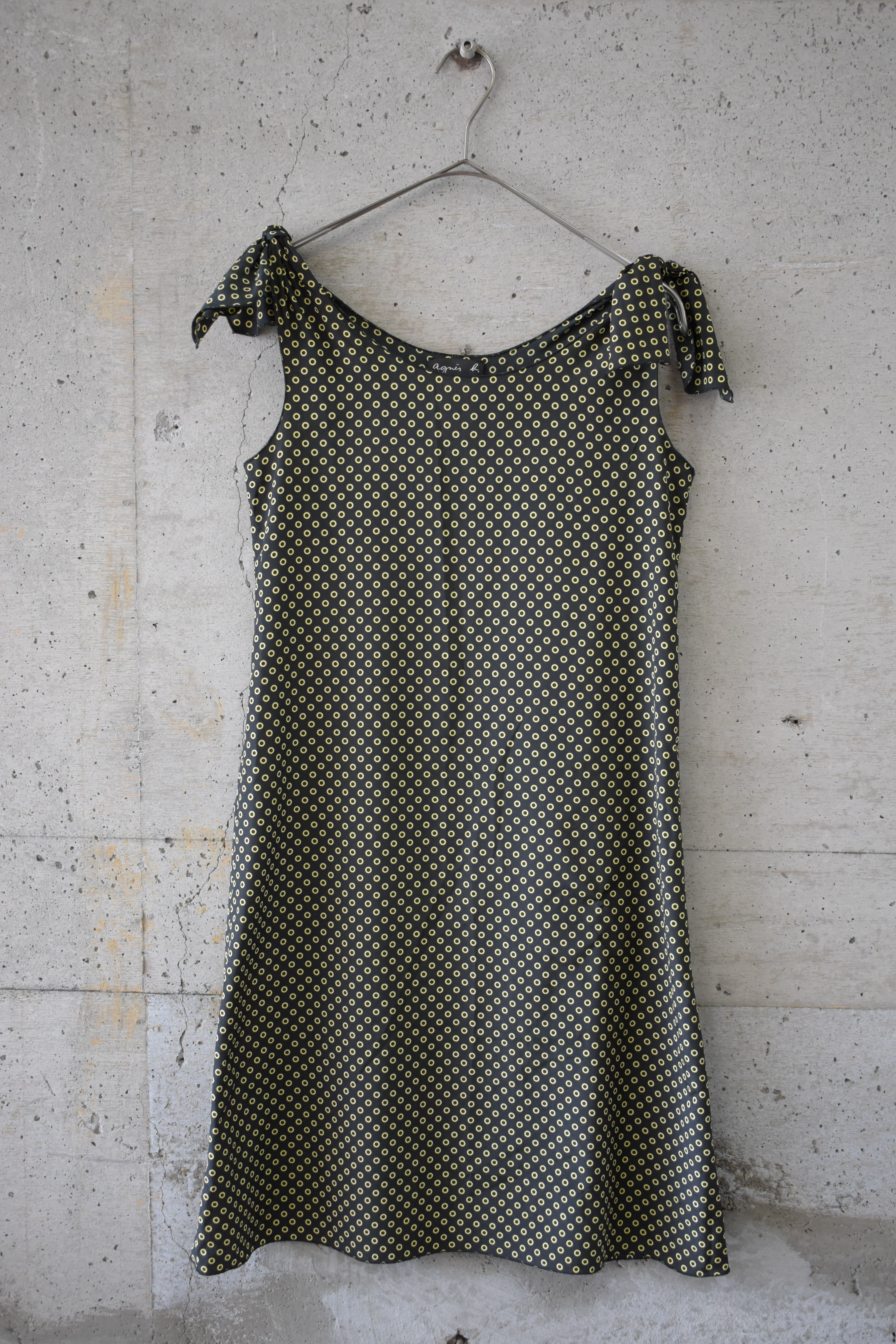 Black and yellow dress with a hollow-dot pattern